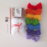 Contents of DIY crochet amigurumi snail kit laid out 